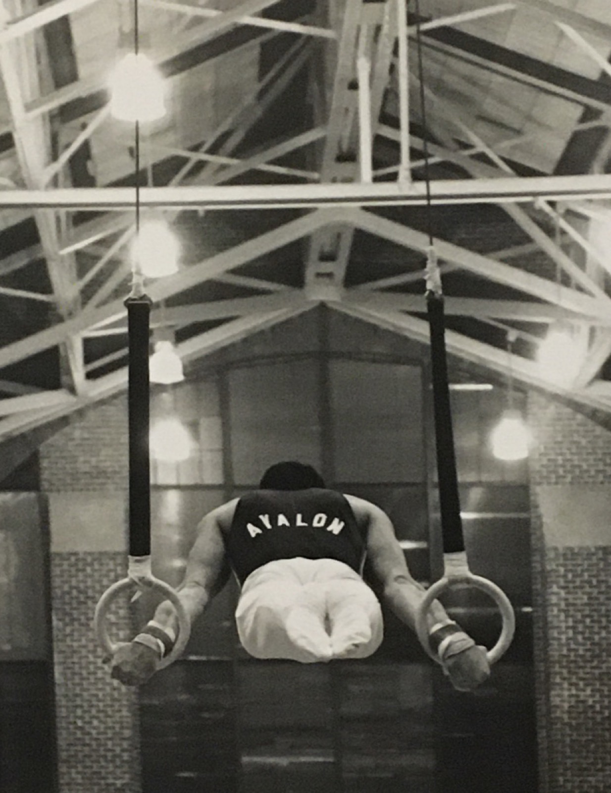 Young Yuval on gymnastics rings — below view